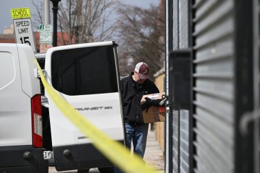 FBI agents gather at the crime scene at a warehouse to collect evidence following a double homicide in Mount Vernon, New York. Mount Vernon, New York, USA: On the morning of Tuesday, March 19, 2024, an attempted robbery and shooting  clipart