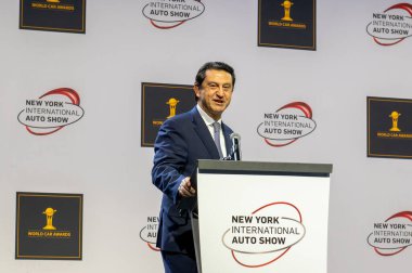 The New York International Auto Show 2024. March 27, 2024, New York, New York, USA: Jose Munoz, global president and COO of Hyundai Motor Company and the president and CEO of Hyundai and Genesis Motor North America, receives the 2024  clipart