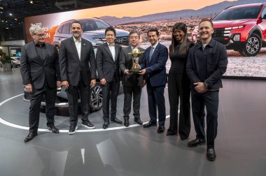 The New York International Auto Show 2024. March 27, 2024, New York, New York, USA: Jose Munoz (3R), global president and COO of Hyundai Motor Company and the president and CEO of Hyundai and Genesis Motor North America, poses with the 2024  clipart
