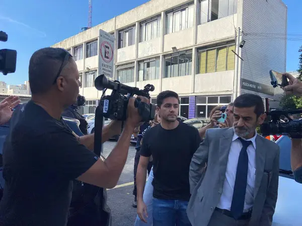 stock image SAO PAULO (SP) 04/01/2024 Fernando Sastre de Andrade Filho, the Porche driver who killed 52-year-old app driver Ornaldo da Silva Viana, arrives at the police station in the Tatuape region, accompanied of his lawyers 