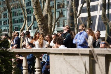 New York City's Solar Eclipse Spectacle: A Phenomenal Afternoon in Bryant Park April 08, 2024, Manhattan , New York, USA:  As the solar eclipse unfolded in New York City's sky, the moon began its journey across the sun clipart