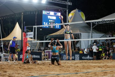 Brasilia (DF), Brazil 05/05/2024 - The pair Ana Patricia and Duda, from Brazil, face the North Americans Nuss and Kloth, in a match valid for the women's final of the Brasilia stage the Beach Volleyball World Circuit clipart