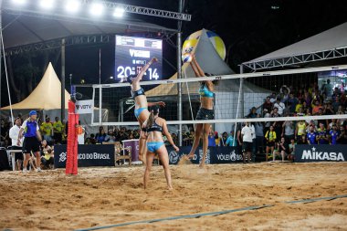 Brasilia (DF), Brazil 05/05/2024 - The pair Ana Patricia and Duda, from Brazil, face the North Americans Nuss and Kloth, in a match valid for the women's final of the Brasilia stage the Beach Volleyball World Circuit clipart