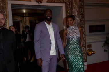 The Pierre Hotel: 2024 Met Gala Departures. May 06, 2024, New York, New York, USA: Dwyane Wade and Gabrielle Union wearing Michael Kors depart the Pierre Hotel for 2024 Met Gala on May 06, 2024 in New York City.  clipart