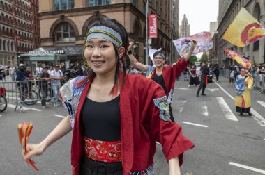 May 18, 2024, New York, USA: Costumed dancers from the Kazanami group dance during the 18th annual Dance Parade and Festival on May 18, 2024 in New York City. clipart