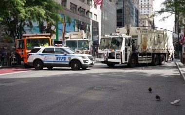(NEW) Israel Day on Fifth Parade Secures Streets with NYPD Barricades. June 02, 2024, New York, USA: Today, the NYPD employed garbage trucks and steel barricades to secure the route for the Israel Day on Fifth Parade, aiming to prevent disruptions  clipart