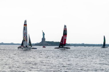 (NEW) SailGP Mubadala New York Sail Grand Prix - Day 1. June 22, 2024, New York, New York, USA: (L-R) Team Germany, Team Rockwool Den and Team Australia SailGP boats race in Fleet 1 on Day 1 of the Mubadala New York Sail Grand Prix at New York Harbor clipart