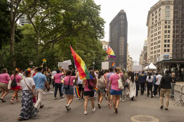 stock image (NEW) 2024 New York City Pride March. June 30, 2024, New York, New York, USA: People with rainbow flags participate in the annual New York City Pride Parade 