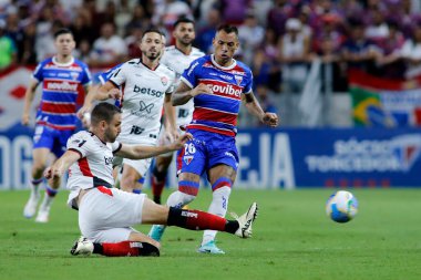 Fortaleza (CE), 07/17/2024 - Fortaleza EC X Vitoria FC - Bruno Uvini and Breno Lopes during the match  at Arena Castelao  clipart