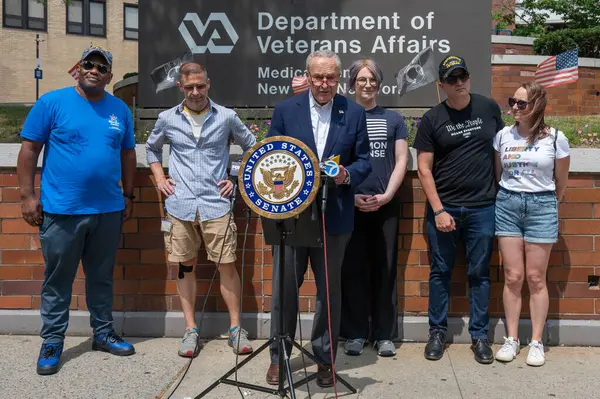 stock image USA, New York, 28 July, 2024: Senate Majority Leader, Chuck Schumer (D-NY) holds photo illustrations on GOP Project 2025 and joined by veterans speaks of danger if Republican candidates will take over White House and Senate at the 2024 election.