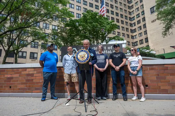 stock image USA, New York, 28 July, 2024: Senate Majority Leader, Chuck Schumer (D-NY) holds photo illustrations on GOP Project 2025 and joined by veterans speaks of danger if Republican candidates will take over White House and Senate at the 2024 election.