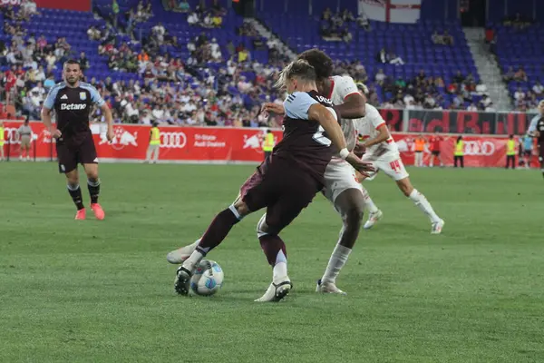 stock image Red Bull Leipzig vs Aston Villa Friendly. July 31, 2024, Harrison, New Jersey, USA: Cash (#2) of Aston Villa dispute ball with Quediaogo (#20) 