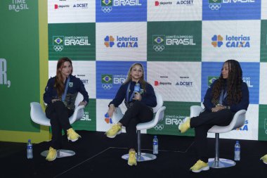 SAO PAULO (SP), Brazil 08/09/2024 - Jade Barbosa, Flavia Saraiva, Lorrane Oliveira. Press conference of Brazilian Olympic gymnasts who won medals at the 2024 Paris Olympic Games, after returning to Brazil. clipart