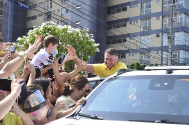 NATAL (RN), Brazil 08/15/2024 - Former president Jair Messias Bolsonaro arrives in the city of Natal to fulfill his political agenda. The former president started the day with an interview on 96 FM and participated in events  clipart