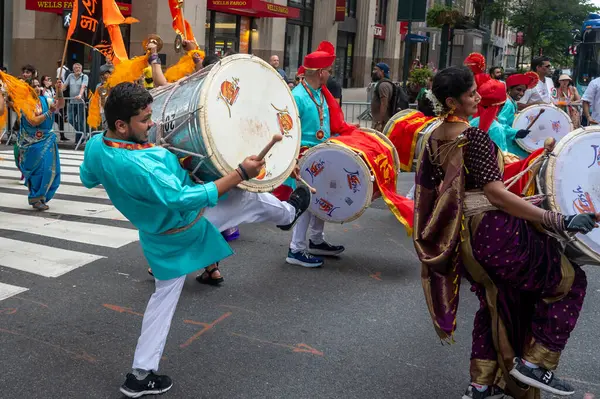 stock image 42nd Annual India Day Parade 2024. August 18, 2024, New York, New York, USA: Participants wearing traditional clothing play musical instruments as they march at the 42nd India Day Parade on Madison Avenue on August 18, 2024 in New York City.  