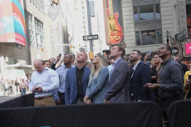 August 20, 2024, New York, USA:  Sunrun rings the opening bell at Nasdaq in Times Square for reaching and powering over 1 million homes with the presence of their CEO, Mary Powell and customers around the USA clipart