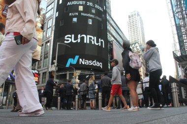 August 20, 2024, New York, USA:  Sunrun rings the opening bell at Nasdaq in Times Square for reaching and powering over 1 million homes with the presence of their CEO, Mary Powell and customers around the USA clipart