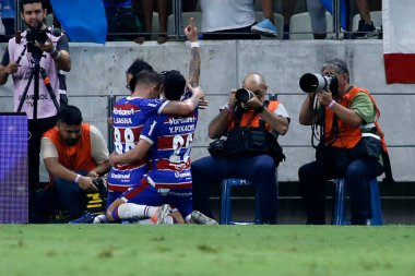 FORTALEZA (CE), Brazil 08/21/2024 - Player Lucas Sasha scores and celebrates his goal during the match between Fortaleza and Rosario Central, valid for the Round of 16 of Conmebol Sudamericana 2024 clipart