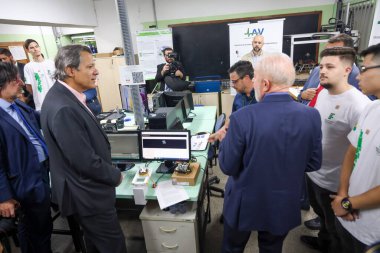 Sao Paulo (SP), Brazil 08/23/2024 The Minister of Economy Fernando Haddad accompanied by the President of the Republic of Brazil Luiz Inacio Lula da Silva visits the laboratory on the IFSP campus  clipart