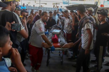 The arrival of Killed Palestinians at the Nasser Medical Complex in Khan Yunis. August 29, 2024, Khan Yunis, Palestine: Families, Friends and loved ones mourn killed Palestinians by Israeli Army clipart