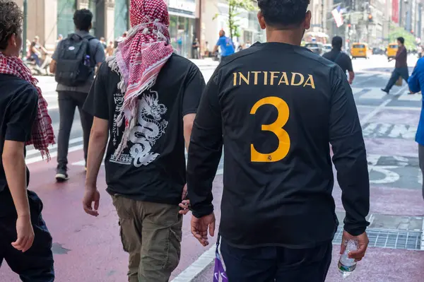 stock image Labor Day March For Gaza Held In New York City. September 02, 2024, New York, New York, USA: A Pro-Palestinian wears an Intifada 3 shirt, Intifada is Arabic word for uprising and during the Second Intifada 1,137 Israelies 