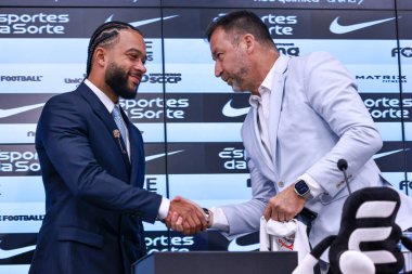 Sao Paulo (SP), Brazil 09/12/2024 - Player Memphis Depay together with Augusto Melo, President of Sport Club Corinthians Paulista, is introduced and gives a press conference to present Corinthians clipart