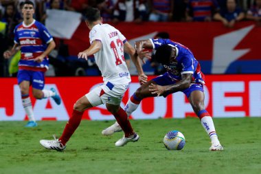 Fortaleza (CE), 09/21/2024 - Players Mancuzo and Arias, during the match between Fortaleza and Bahia, valid for the 27th round of the 2024 Brazilian Championship Serie A clipart