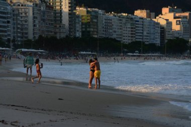 RIO DE JANEIRO (RJ), Brazil 10/06/2024 - Movement on the boardwalk and beaches of Copacabana and Arpoador in the South Zone of Rio de Janeiro on this election Sunday (Fausto Maia / Thenews2) clipart