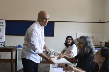 SAO PAULO (SP), Brazil 10/06/2024 The Minister of the Federal Supreme Court Alexandre de Moraes, during voting at the Madre Alix school, in the Jardim Paulistano region (Leco Viana / Thenews2)  clipart