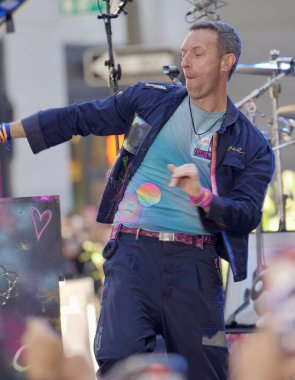 Coldplay Performs live at Today Show in New York. October 8, 2024, New York, USA: Coldplay is performing live on the TODAY Plaza as part of the Citi Concert Series and promoting their new album (niyi_fote_thenews2) clipart