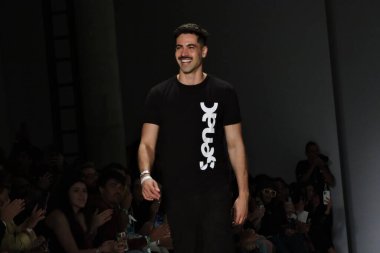 Sao Paulo (SP), 10/19/2024 - Fashion designer Rafael Caetano paid tribute to cartoonist Mauricio de Sousa, creator of Turma da Monica, on the sixth day of Sao Paulo Fashion Week (SPFW) N58. (Leandro Chemalle/Thenews2) clipart