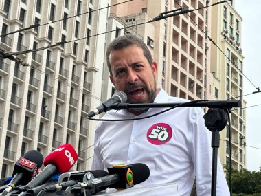 Sao Paulo (SP), Brazil 10/21/2024 - Candidate Guilherme Boulos (PSOL), makes a speech reading an open letter to the Press about the final stretch of the campaign for mayor of Sao Paulo at Viaduto do Cha  clipart