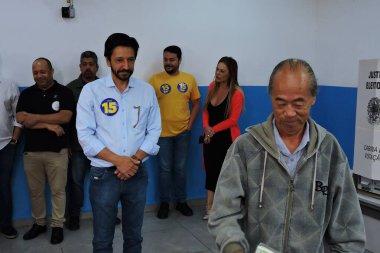 Sao paulo (sp), 10/27/2024 - the candidate for reelection ricardo nunes (mdb), votes at the ee don duarte leopoldo e silva state school in socorro, south zone of the capital on morning of this sunday, october 27, 2024. (Leandro Chemalle/Thenews2)  clipart