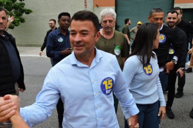 Sao paulo (sp), Brazil 10/27/2024 - the candidate for vice-mayor on ricardo nunes' ticket, colonel melo araujo voted at the e.e professor benedita ribas f. Silveira state school in sao jorge park (leandro chemalle / thenews2) clipart