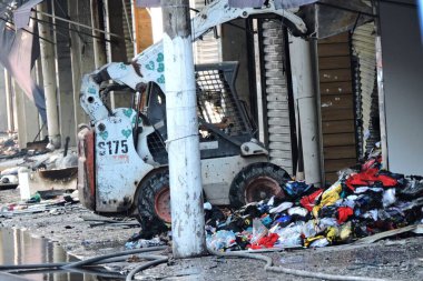 Sao Paulo (SP), Brazil 11/30/2024 - The fire that hit Shopping 25 in Bras, central Sao Paulo, was controlled late Wednesday afternoon. Machines and tractors are removing clothes and products that were not burned.  (leandro chemalle / thenews2) clipart