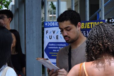 Sao paulo (sp), 11/17/2024 - education / entrance exam/fuvest/sp. - students arrive to take the first phase of fuvest 2025, the largest entrance exam in the country competing for places at usp. (Leandro Chemalle/Thenews2) clipart