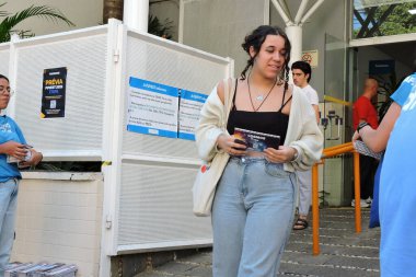 Sao paulo (sp), 11/17/2024 - the first students leave the first phase of the fuvest exam site at the unip pinheiros unit, in the west zone of sao paulo, at the end of the afternoon this sunday (17). (Leandro Chemalle/Thenews2) clipart