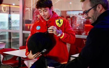 Las Vegas, Nevada, USA: November 20, 2024 - french Charles Leclerc of Ferrari being interviewed and receives helmet as a gift at formula 1 Las Vegas Grand Prix taking place from november 21-23, 2024. (Niyi Fote/Thenews2) clipart