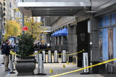 police mark evidence found at the scene with evidence markers as ceo of unitedhealthcare brian thompson, 50, was shot and killed as he entered the new york hilton after 6:45am. December 4, 2024, midtown manhattan, new york, usa (kyle mazza thenews2) clipart