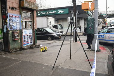 new york city police department crime scene investigators at the scene of a 34-year-old man being stabbed multiple times to death at mucho luco deli grocery in brownsville, brooklyn, new york. Tuesday, december 17, 2024 (kyle mazza / thenews2) clipart