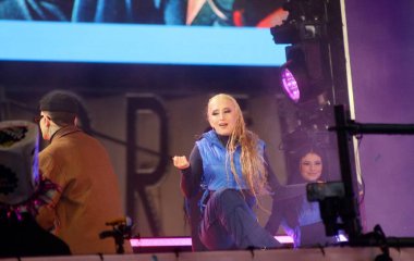 December 31, 2024, new york, usa: colombian singer, juan david loaiza supulveda, known as kapo, performs live at new year's eve celebrations at times square amid rainfall (niyi fote / thenews2) clipart