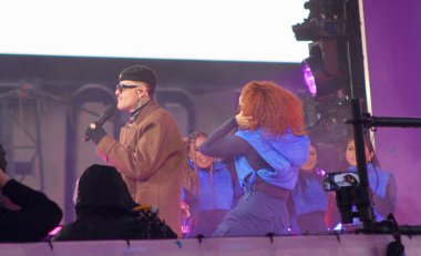 December 31, 2024, new york, usa: colombian singer, juan david loaiza supulveda, known as kapo, performs live at new year's eve celebrations at times square amid rainfall (niyi fote / thenews2) clipart