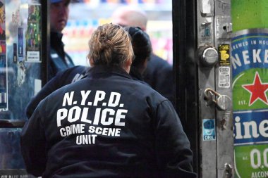 nypd crime scene unit investigators, force investigation division and other officers at the scene of a police involved shooting where police shot an individual in the area of east 80th street and flatlands avenue in the canarsie section clipart