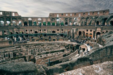 Discover the stunning interior of the Roman Colosseum, showcasing its ancient architecture, arena, underground structures, and iconic UNESCO World Heritage status in Rome, Italy. clipart