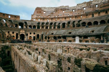 Discover the stunning interior of the Roman Colosseum, showcasing its ancient architecture, arena, underground structures, and iconic UNESCO World Heritage status in Rome, Italy. clipart