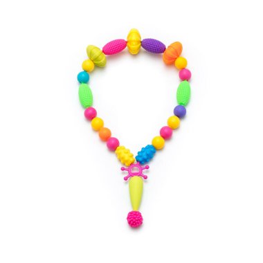 Colorful set of childrens toys, beads, decorations isolated on white background.