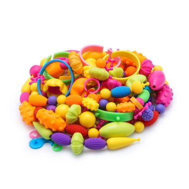 Colorful set of childrens toys, beads, decorations isolated on white background.