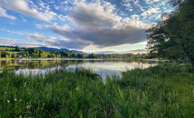 Scenic sky above the lake of Bad Bayersoien in the Bavarian Alps, Germany