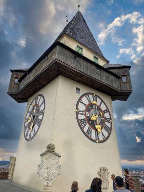 Iconic historic clock tower in the city center of Graz, Austria