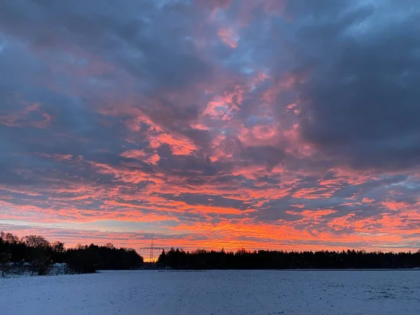 Scenic sunrise above a winter landscape in the Munich suburbs